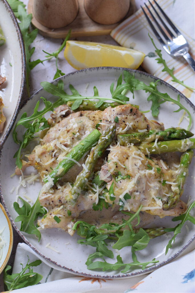 close up of lemon cream chicken with asparagus.