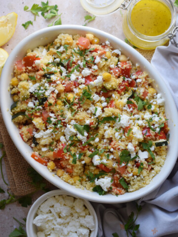 Couscous and chickpea salad in a serving bowl.