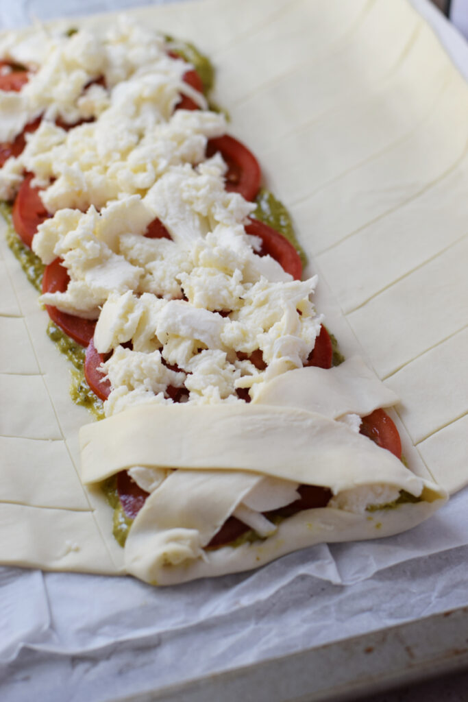 Folding pastry strips.