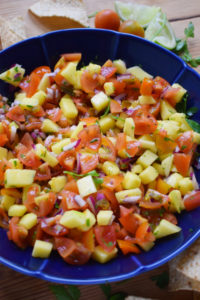 Mango Pico de gallo in a blue bowl.