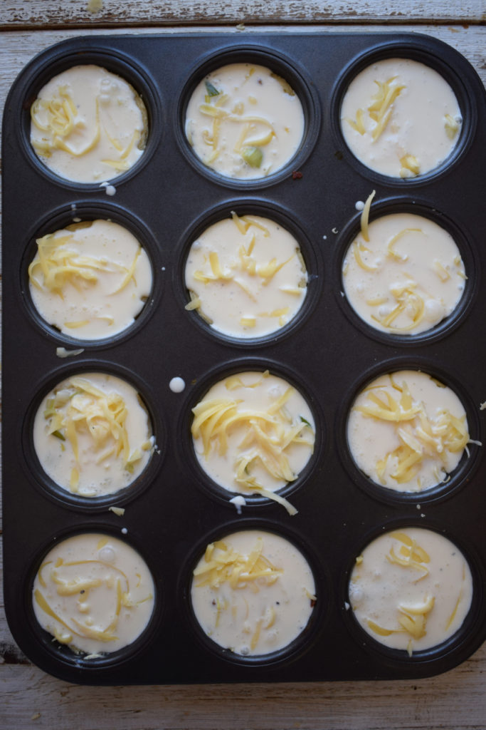 Filled mini quiche ready to bake.