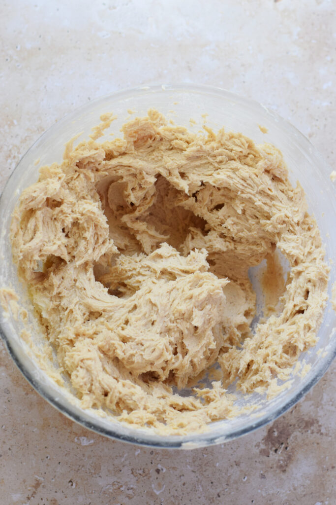 Making muffin batter in a glass bowl.
