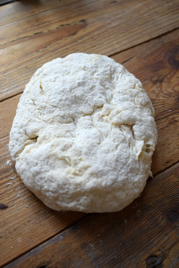 pizza dough on a wooden board