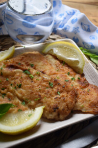 close up of the pan fried hake on a plate