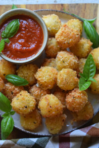 Panko crusted cheese balls with fresh basil.