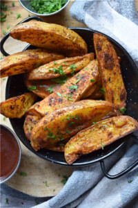 close up of papriks spiced potato wedges