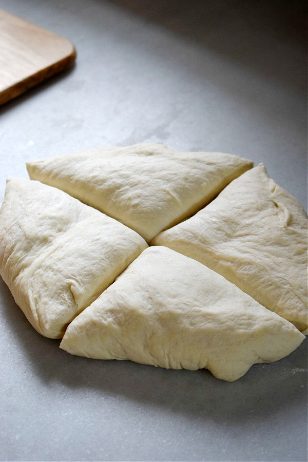 Dough divided into four portions.
