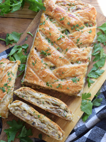 Mushroom puff pastry braid on a serving board.