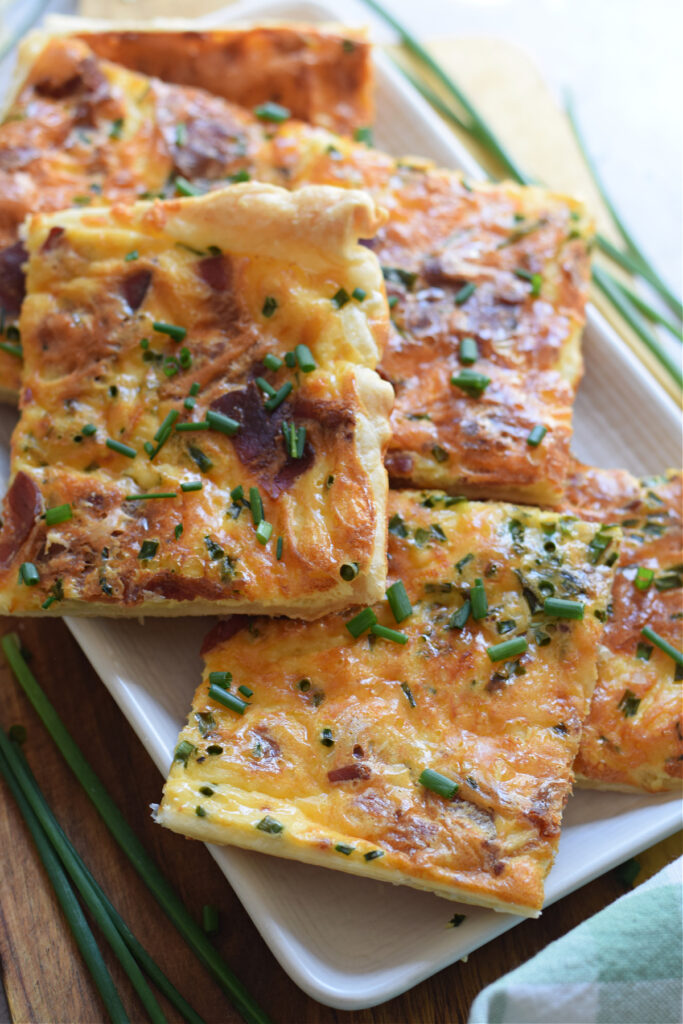 Close up of puff pastry breakfast quiche.