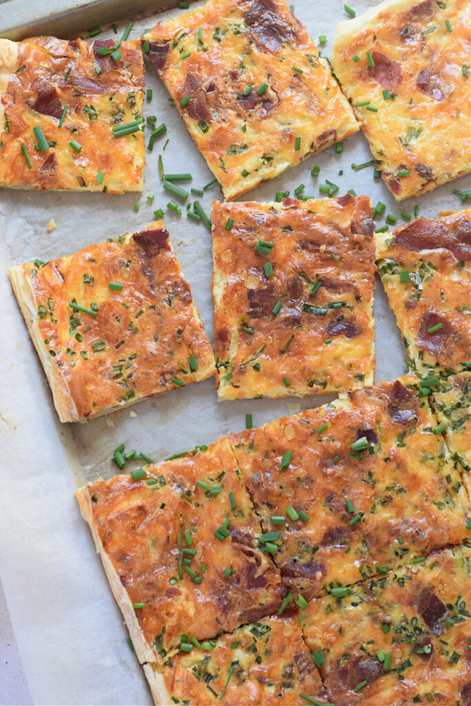 Sheet pan quiche cut into squares.