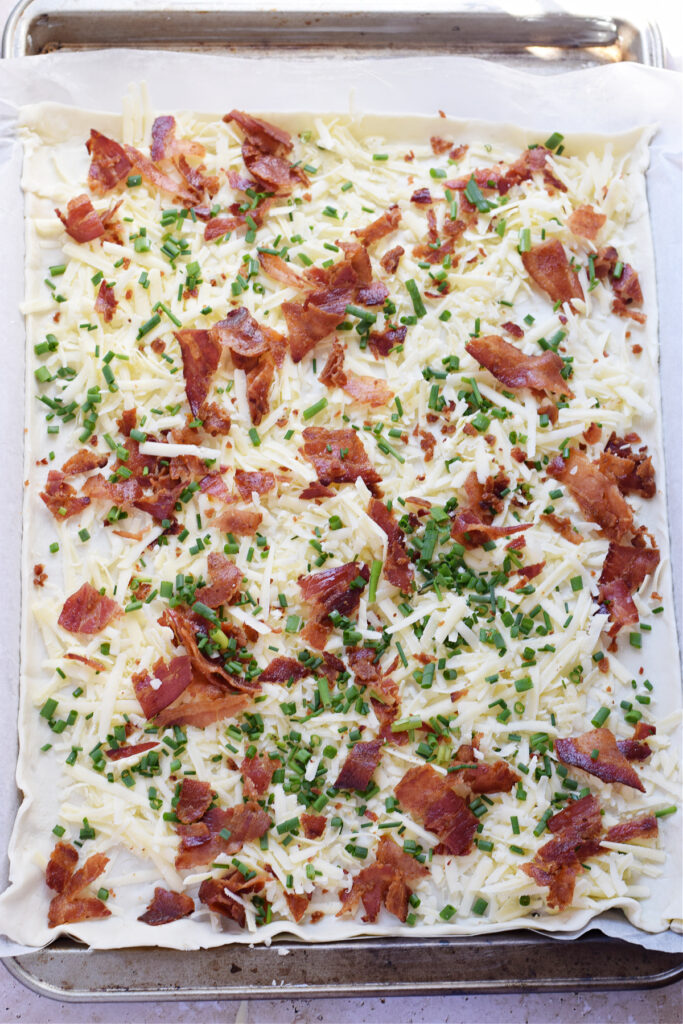 Puff pastry with bacon, cheese and chives.
