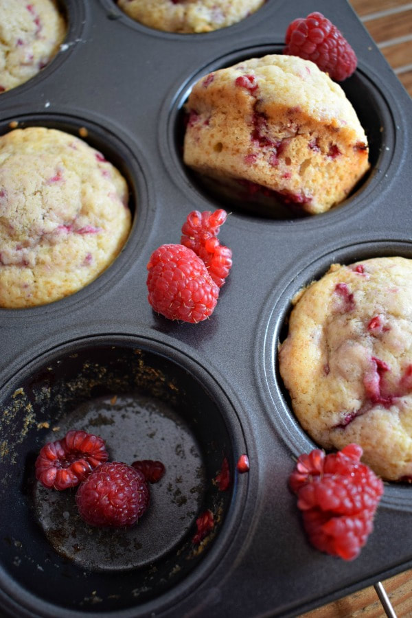 raspberry muffins in a tray.