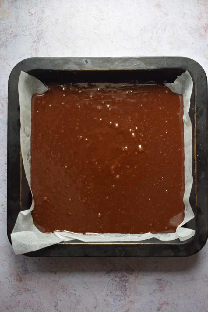 Ready to bake brownies in a pan.