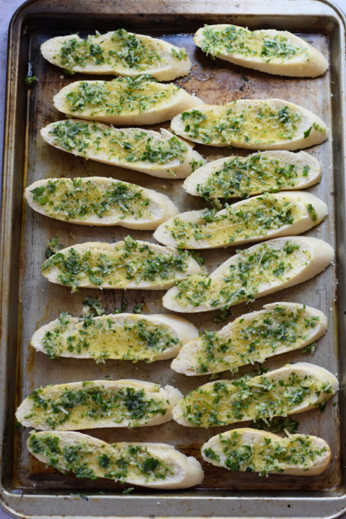 Ready to bake crostini on a baking tray.