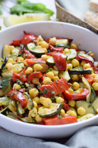 Roasted vegetable chickpea salad in a bowl.