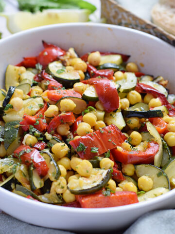 Roasted vegetable chickpea salad in a bowl.
