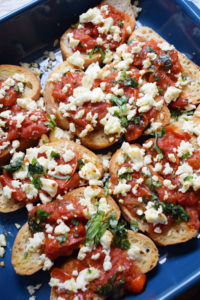 close up of the roasted tomato and feta bruschetta