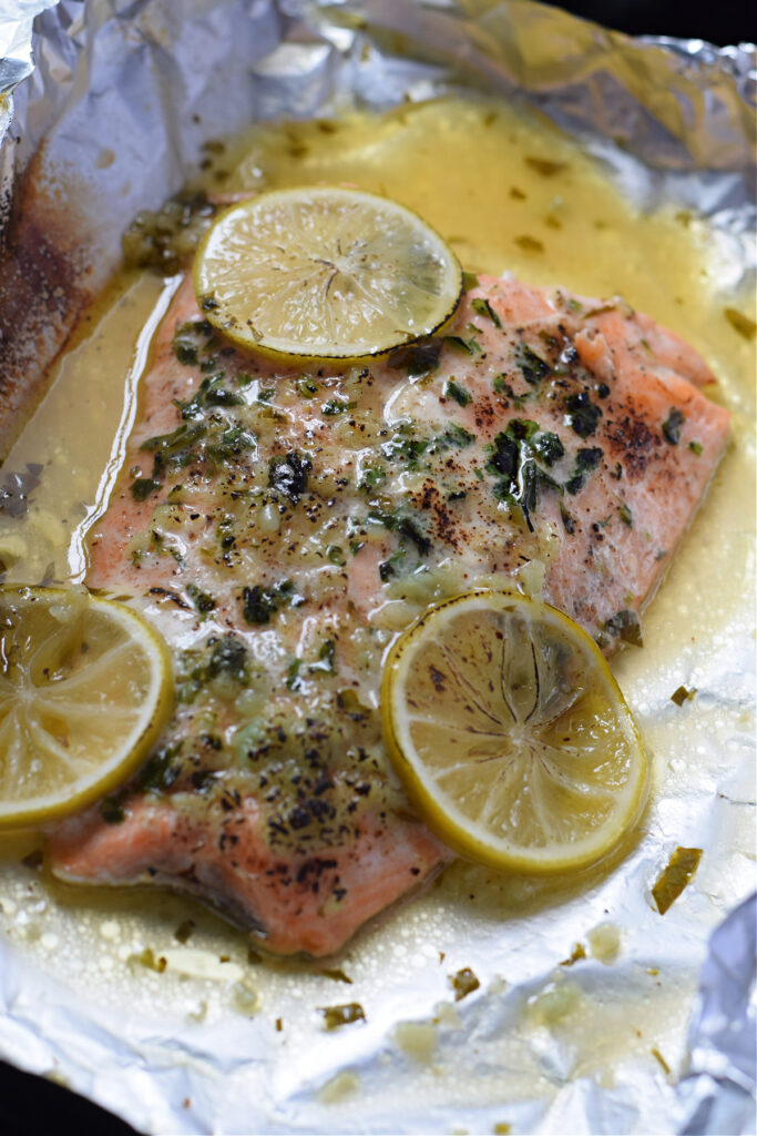 Baked honey lime salmon in a sheet of foil paper.