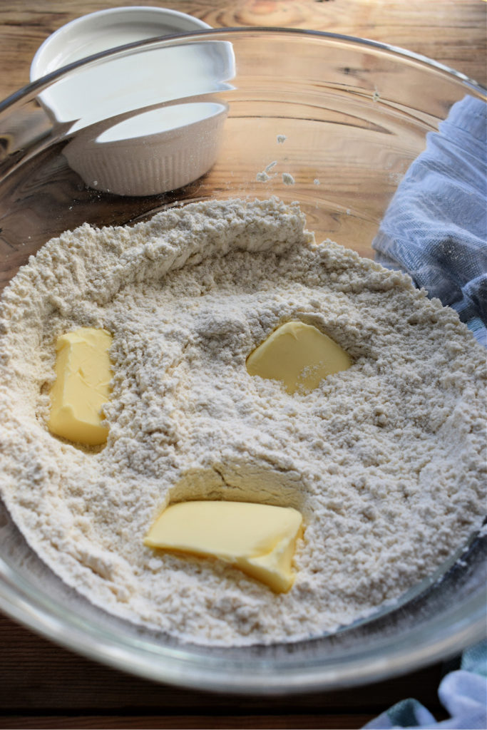 Making scone batter in a glass bowl.