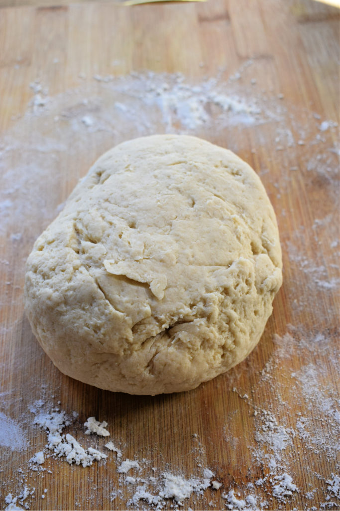 Scone dough on a wooden table.