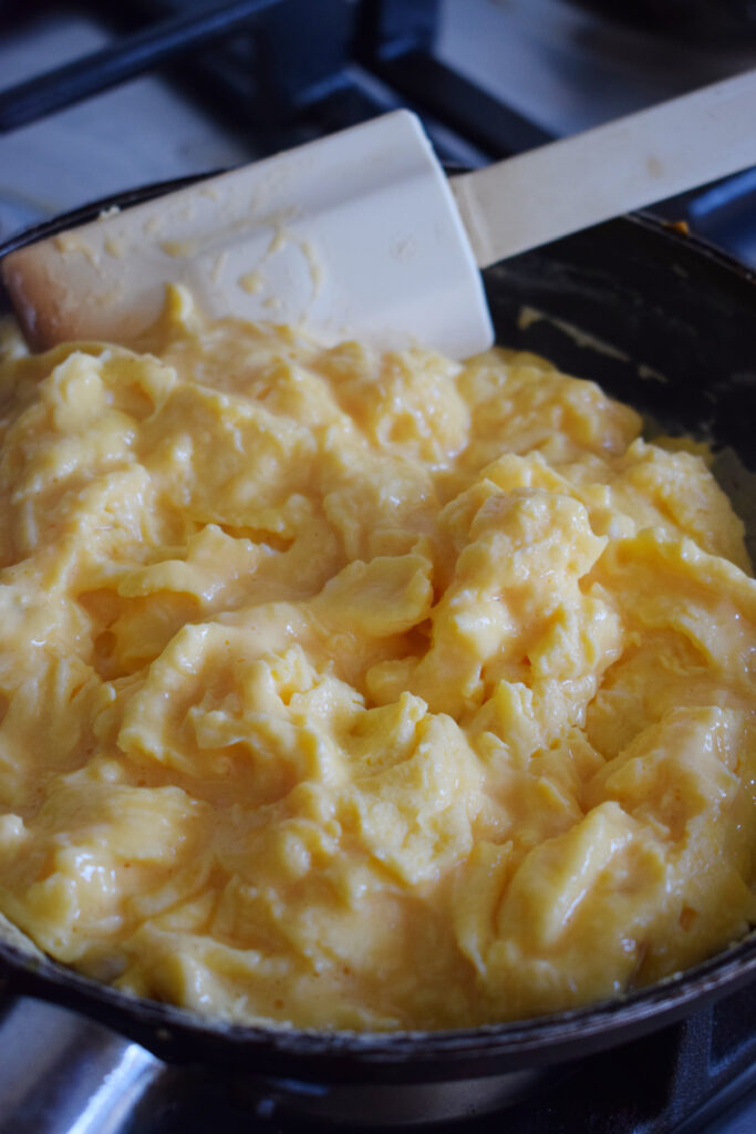 Scrambled eggs in a skillet.