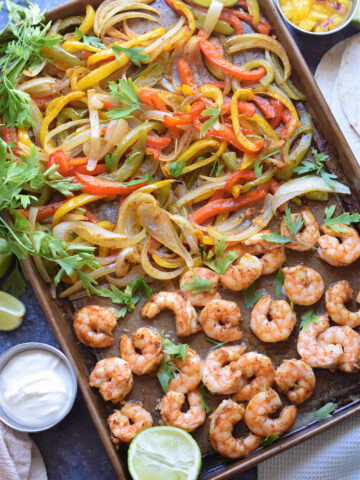 Peppers and shrimp on a baking tray.