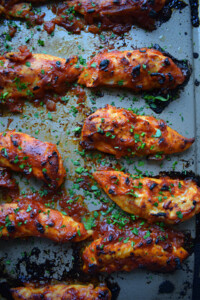 spicy barbecue chicken tenders on a baking tray