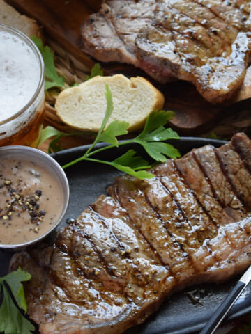Close up of a steak with pepper sauce.