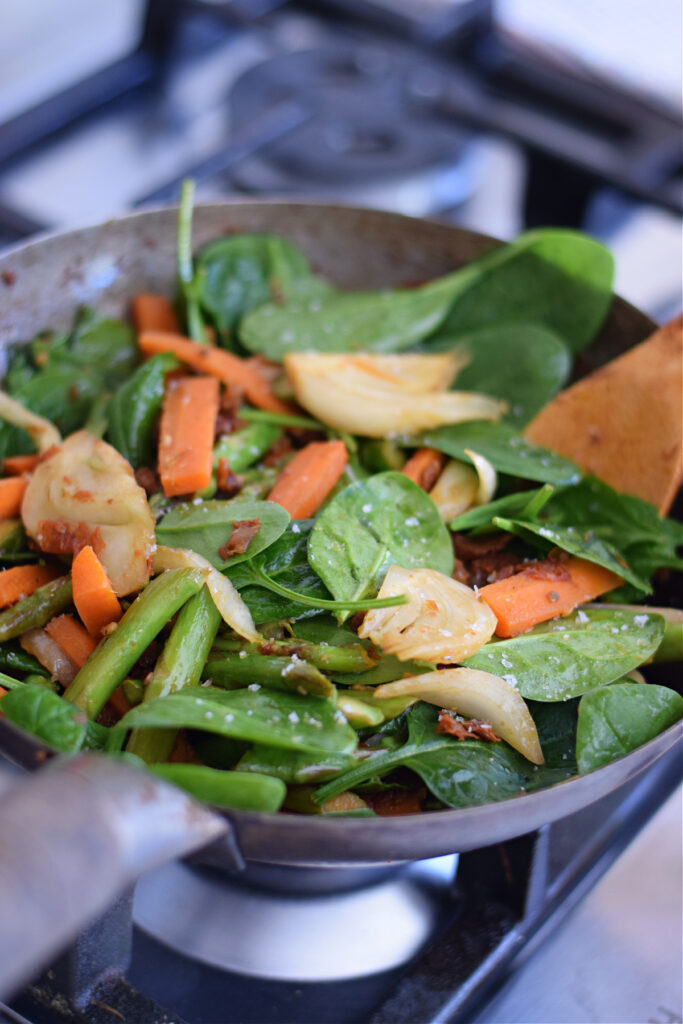 Vegetable stir fry in a wok.