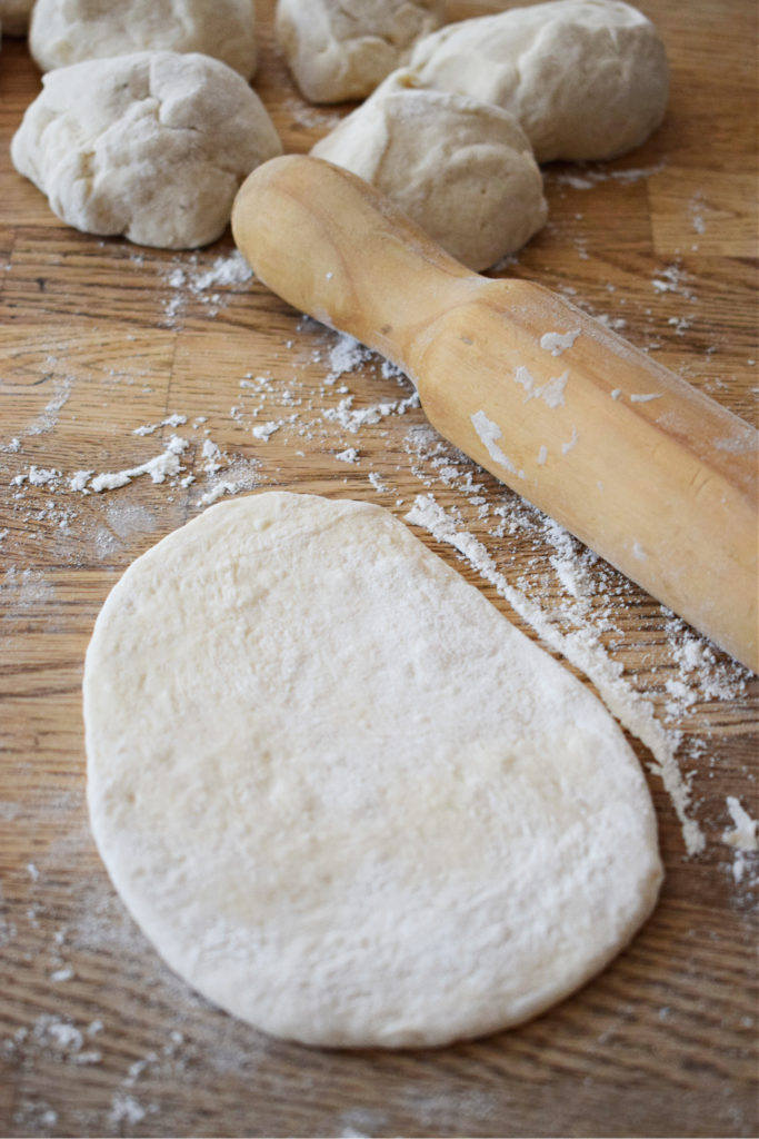 dough rolled out ot make stove top nann bread