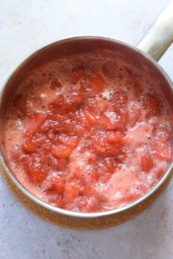 Strawberry compote in a saucepan.
