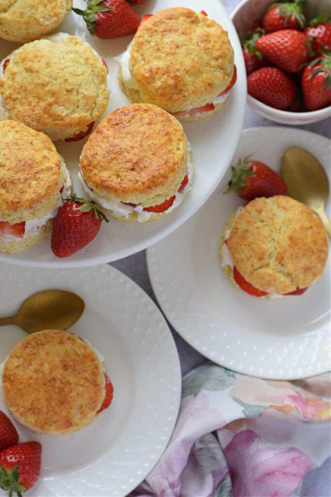 Strawberry scones on  white platees.
