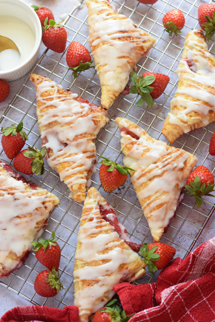 Strawberry turnovers on a baking trya.