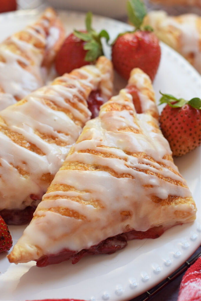 Close up of a strawberry turnover on a plate.