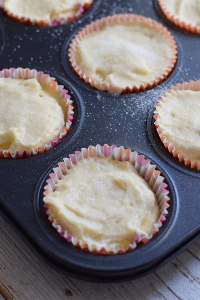 Sugar sprinkled over lemon muffins.