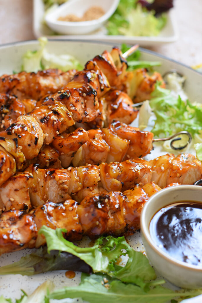 Close up of grilled teriyaki chicken skewers.