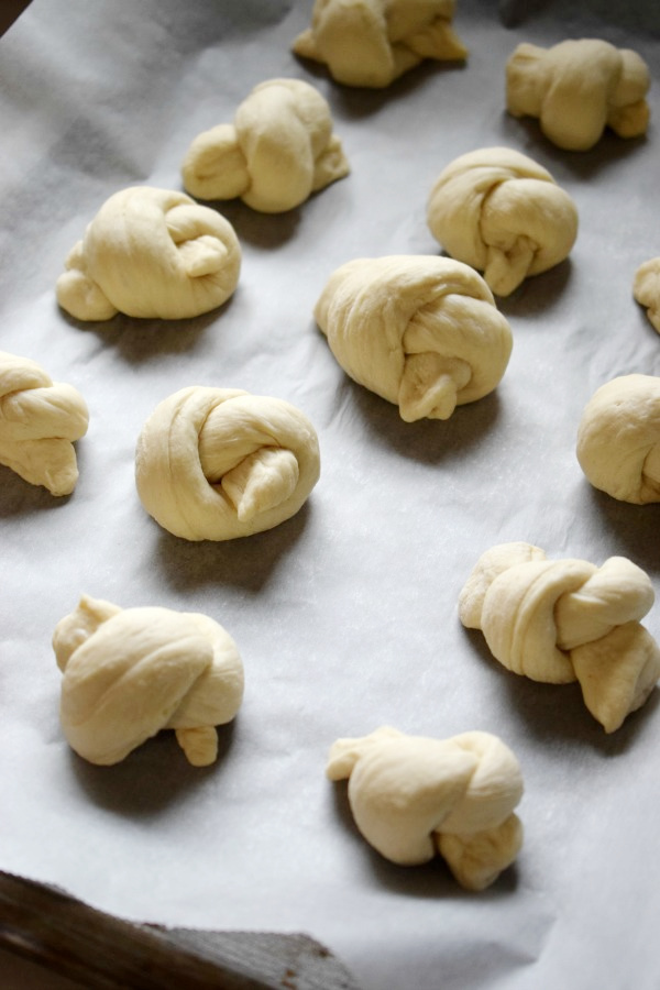 Garlic knots on a baking tray.