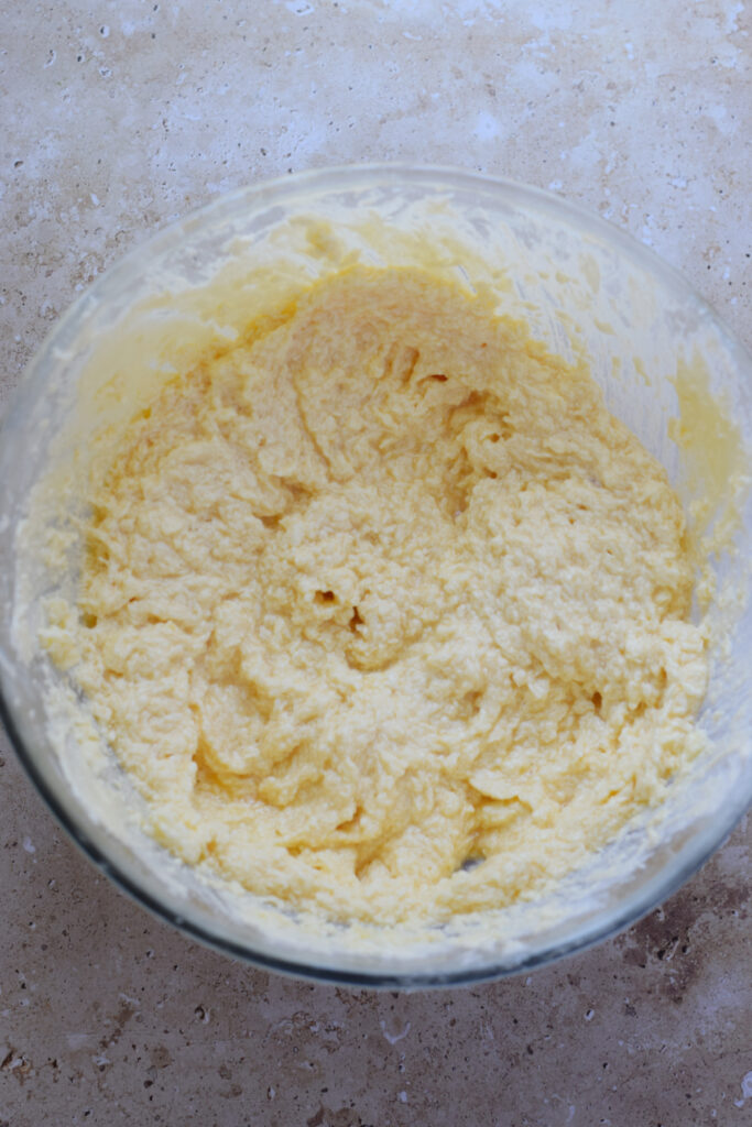 Making muffin batter in a bowl.