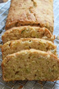 Zucchini bread sliced up in a loaf.